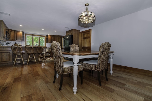 153 N Rd, Brentwood, NH 03833 - dining space featuring a chandelier, wood finished floors, and recessed lighting
