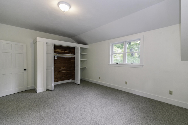 153 N Rd, Brentwood, NH 03833 - unfurnished bedroom with light colored carpet, lofted ceiling, and a closet