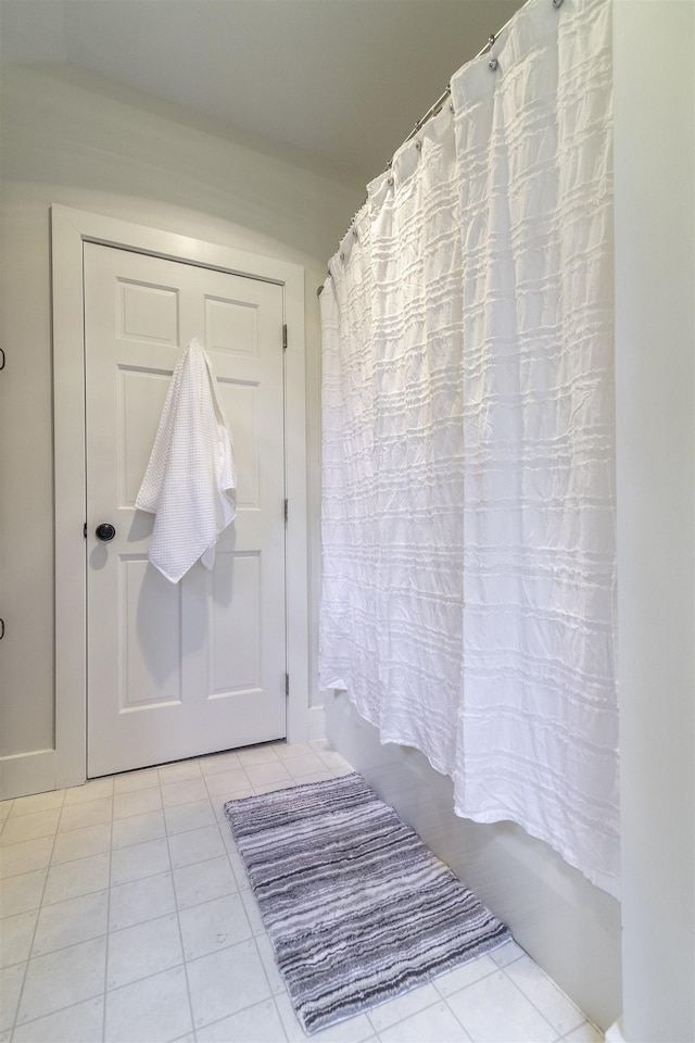 153 N Rd, Brentwood, NH 03833 - full bathroom with tile patterned floors and shower / tub combo with curtain
