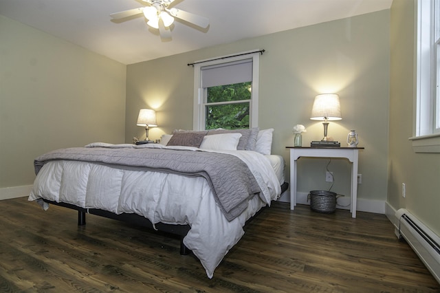 153 N Rd, Brentwood, NH 03833 - bedroom with a baseboard radiator, dark wood finished floors, and ceiling fan