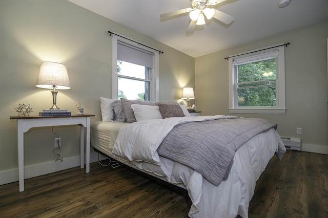 153 N Rd, Brentwood, NH 03833 - bedroom with multiple windows, baseboard heating, dark wood finished floors, and ceiling fan