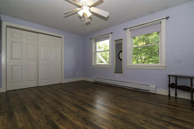 153 N Rd, Brentwood, NH 03833 - unfurnished bedroom featuring a baseboard heating unit, dark wood-style flooring, a closet, and a ceiling fan
