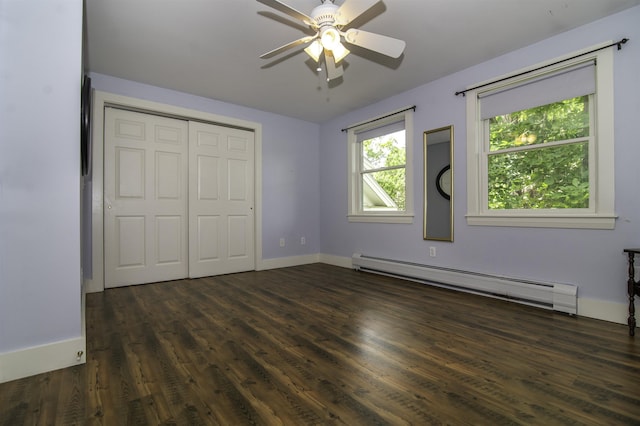 153 N Rd, Brentwood, NH 03833 - unfurnished bedroom featuring a baseboard heating unit, dark wood-type flooring, a closet, and ceiling fan
