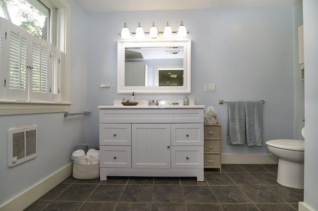 153 N Rd, Brentwood, NH 03833 - bathroom with heating unit, vanity, and plenty of natural light