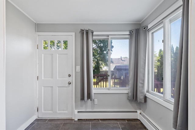 24B Grand Ave, Nashua, NH 03060 - entrance foyer with a baseboard radiator, dark tile patterned floors, and crown molding