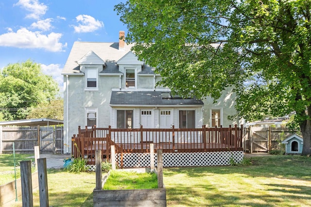 24B Grand Ave, Nashua, NH 03060 - rear view of house with a deck, stucco siding, a fenced backyard, a chimney, and a gate