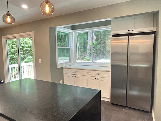 32 Muddy Pond Rd, Kensington, NH 03833 - kitchen with freestanding refrigerator, white cabinetry, decorative light fixtures, finished concrete floors, and recessed lighting