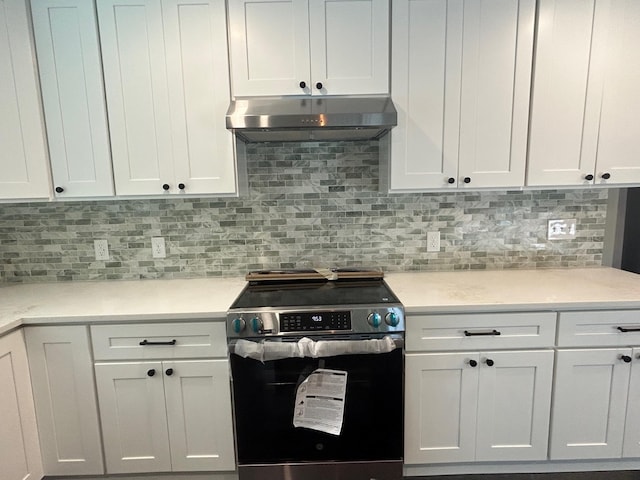 32 Muddy Pond Rd, Kensington, NH 03833 - kitchen featuring electric range, under cabinet range hood, light countertops, and white cabinets
