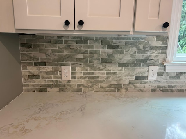 32 Muddy Pond Rd, Kensington, NH 03833 - kitchen view of white cabinets, backsplash, and light stone counters