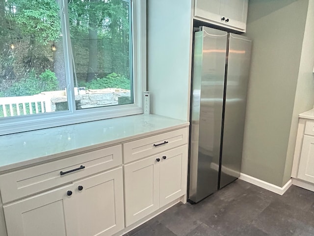 32 Muddy Pond Rd, Kensington, NH 03833 - kitchen featuring freestanding refrigerator, white cabinets, and light countertops