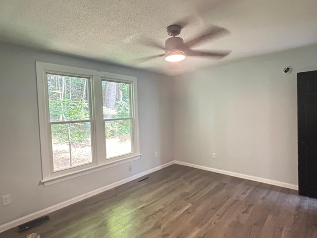 32 Muddy Pond Rd, Kensington, NH 03833 - unfurnished room featuring dark wood-style floors, ceiling fan, and a textured ceiling