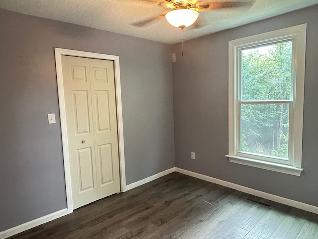 32 Muddy Pond Rd, Kensington, NH 03833 - spare room with a ceiling fan, dark wood-style floors, and a textured ceiling