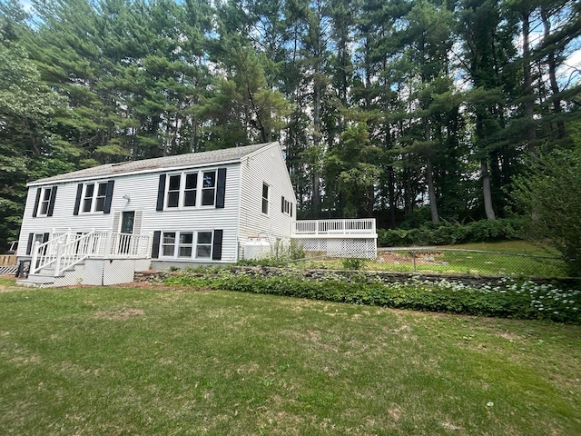 32 Muddy Pond Rd, Kensington, NH 03833 - view of front facade with view of scattered trees and a wooden deck