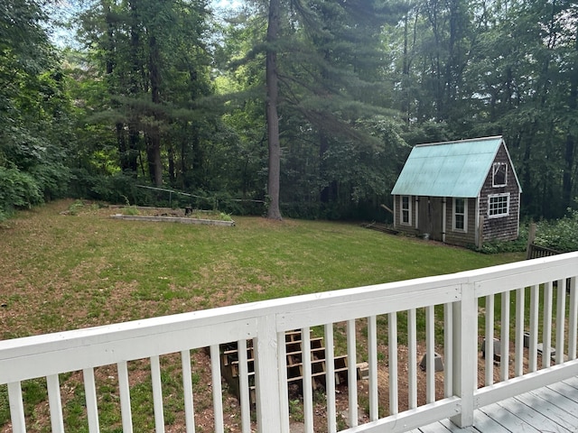32 Muddy Pond Rd, Kensington, NH 03833 - view of grassy yard with a deck and an outdoor structure