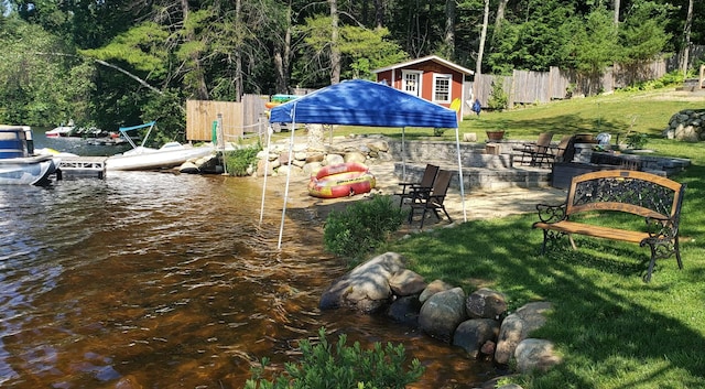 21 Monomonac Ter, Rindge, NH 03461 - view of yard featuring a dock, an outbuilding, and a water view