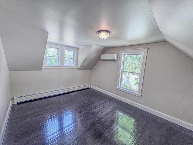 1043 Main St, Sunapee, NH 03751 - additional living space featuring baseboard heating, healthy amount of natural light, lofted ceiling, and dark wood-style flooring