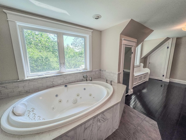 1043 Main St, Sunapee, NH 03751 - full bath featuring a whirlpool tub and tile patterned flooring