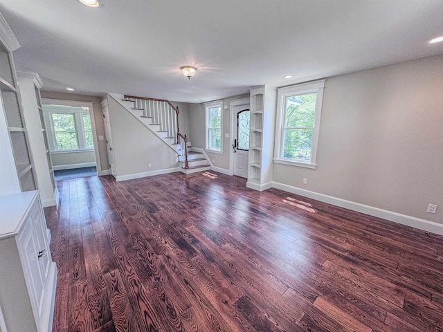 1043 Main St, Sunapee, NH 03751 - unfurnished living room with stairway, dark wood-style flooring, and recessed lighting