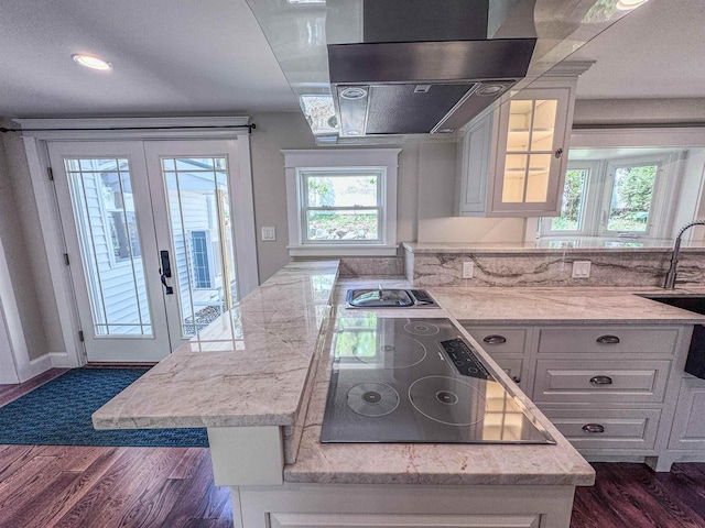 1043 Main St, Sunapee, NH 03751 - kitchen featuring french doors, range hood, dark wood-style floors, stovetop, and white cabinets