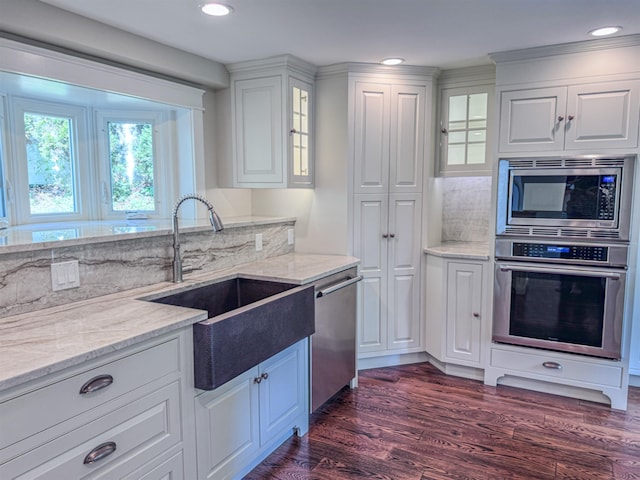 1043 Main St, Sunapee, NH 03751 - kitchen featuring stainless steel appliances, white cabinetry, dark wood-style floors, glass insert cabinets, and recessed lighting