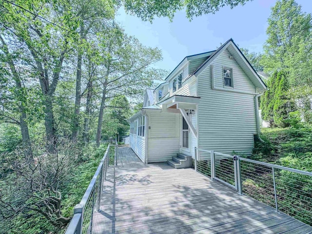 1043 Main St, Sunapee, NH 03751 - rear view of house with a wooden deck