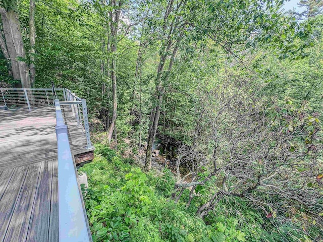 1043 Main St, Sunapee, NH 03751 - wooden terrace featuring a view of trees