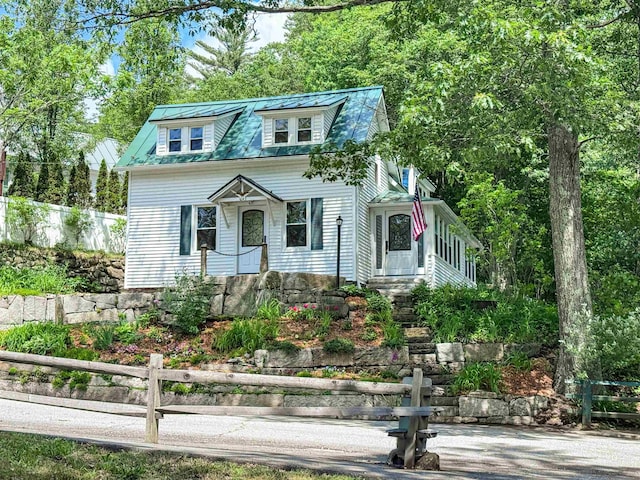 1043 Main St, Sunapee, NH 03751 - view of front facade with a metal roof