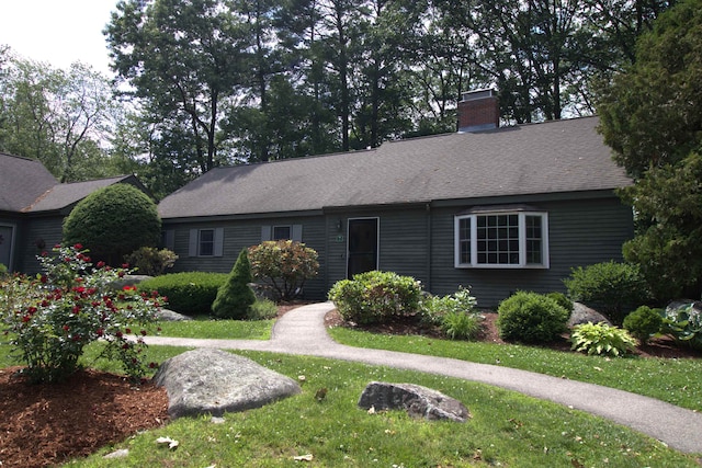 7 Minuteman Ln Unit 7, Exeter, NH 03833 - ranch-style house with a front yard, a chimney, and a shingled roof