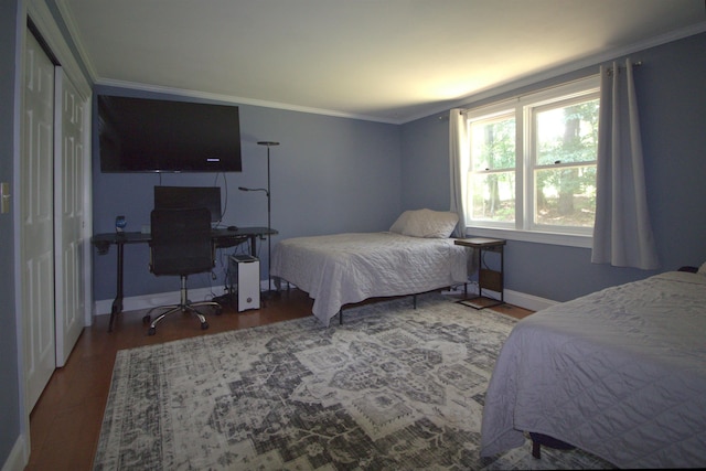 7 Minuteman Ln Unit 7, Exeter, NH 03833 - bedroom featuring wood finished floors, crown molding, and a desk