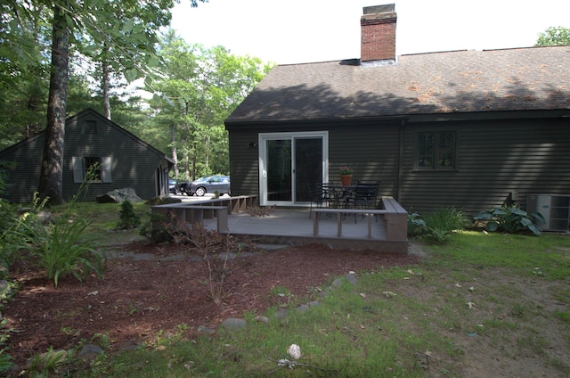 7 Minuteman Ln Unit 7, Exeter, NH 03833 - rear view of house with a wooden deck, a chimney, and roof with shingles
