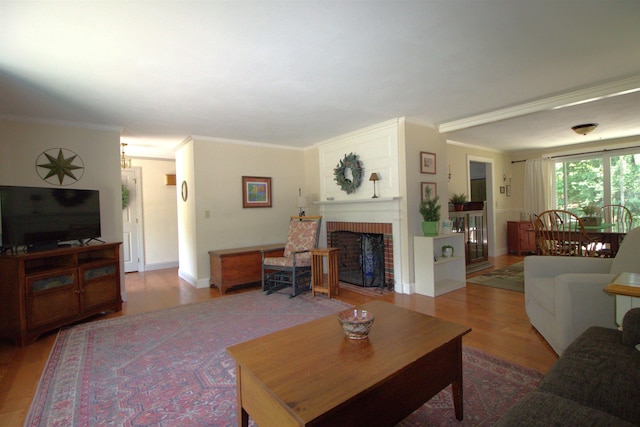 7 Minuteman Ln Unit 7, Exeter, NH 03833 - living room featuring wood finished floors, a fireplace, and crown molding