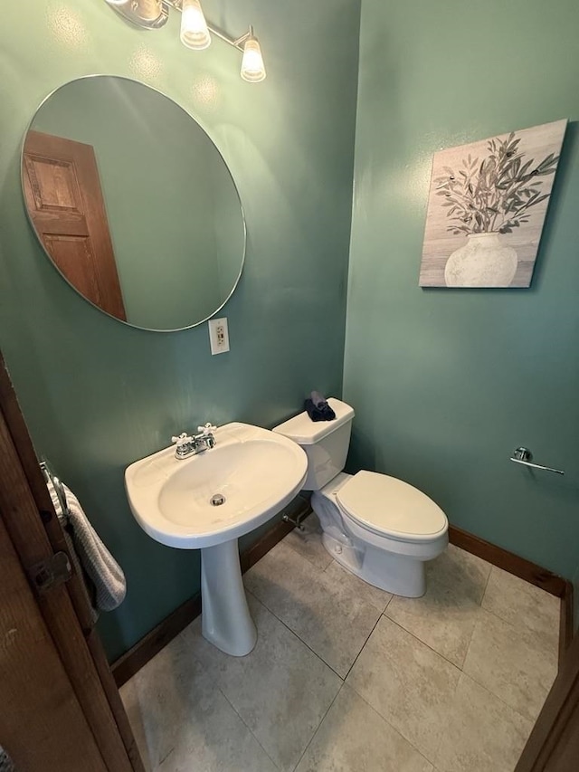 136 Sparhawk St, Portsmouth, NH 03801 - half bathroom featuring toilet and tile patterned flooring