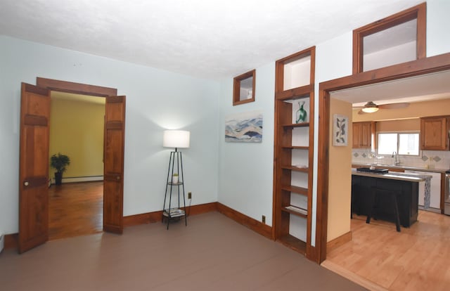 136 Sparhawk St, Portsmouth, NH 03801 - corridor featuring a baseboard radiator and light wood-type flooring