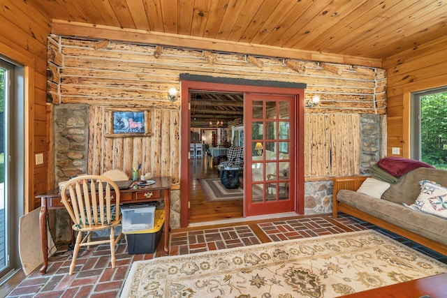 83 Towle Rd, Jackson, NH 03846 - sitting room with brick flooring, wooden walls, and wood ceiling
