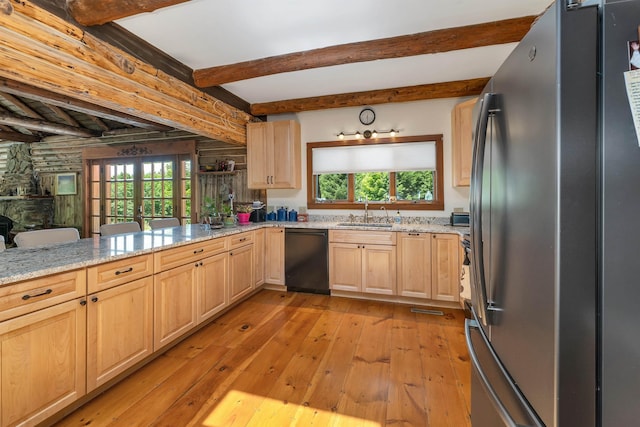 83 Towle Rd, Jackson, NH 03846 - kitchen with freestanding refrigerator, black dishwasher, light brown cabinets, light wood-style flooring, and beamed ceiling