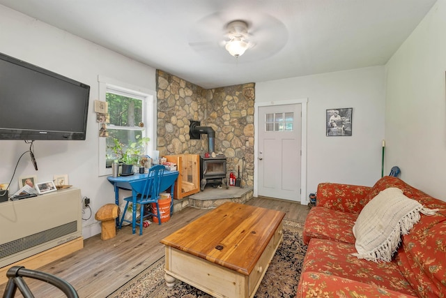 83 Towle Rd, Jackson, NH 03846 - living room featuring a wood stove, wood finished floors, and a ceiling fan