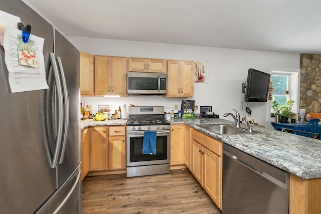 83 Towle Rd, Jackson, NH 03846 - kitchen featuring stainless steel appliances, a peninsula, wood finished floors, light brown cabinets, and light stone counters