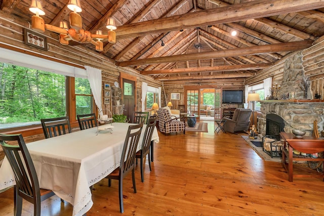 83 Towle Rd, Jackson, NH 03846 - dining room featuring a wood ceiling with exposed beams, hardwood / wood-style floors, a fireplace, and high vaulted ceiling