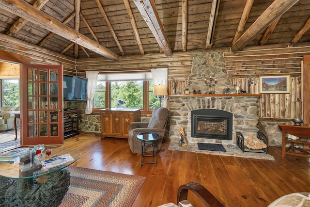 83 Towle Rd, Jackson, NH 03846 - living room with wooden ceiling, log walls, hardwood / wood-style floors, and a stone fireplace