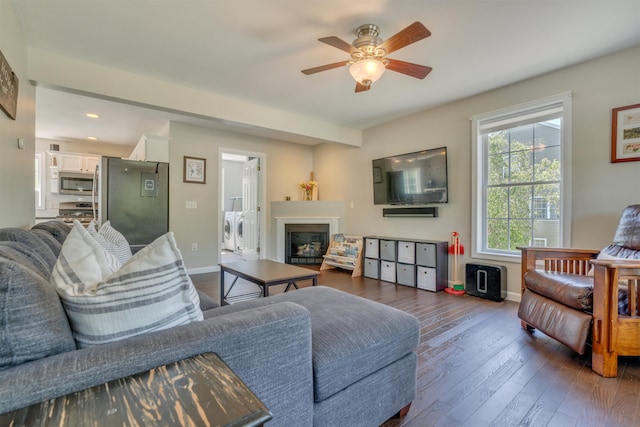 15 Winslow Dr, Somersworth, NH 03878 - living room featuring washing machine and dryer, ceiling fan, a glass covered fireplace, dark wood finished floors, and recessed lighting
