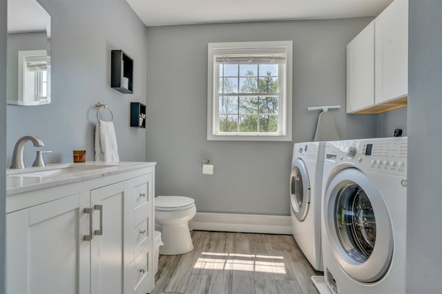 15 Winslow Dr, Somersworth, NH 03878 - laundry area featuring washing machine and dryer and light wood-type flooring