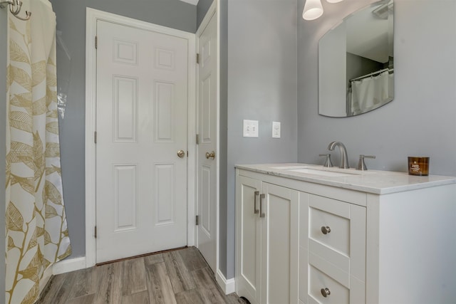 15 Winslow Dr, Somersworth, NH 03878 - bathroom featuring wood finished floors, vanity, and a shower with curtain