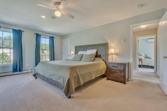 15 Winslow Dr, Somersworth, NH 03878 - bedroom featuring light colored carpet, an AC wall unit, baseboard heating, and a ceiling fan