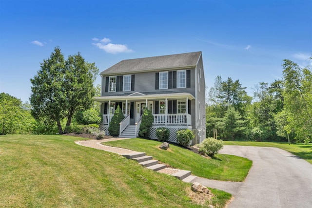 15 Winslow Dr, Somersworth, NH 03878 - colonial inspired home with a porch, asphalt driveway, and a front lawn