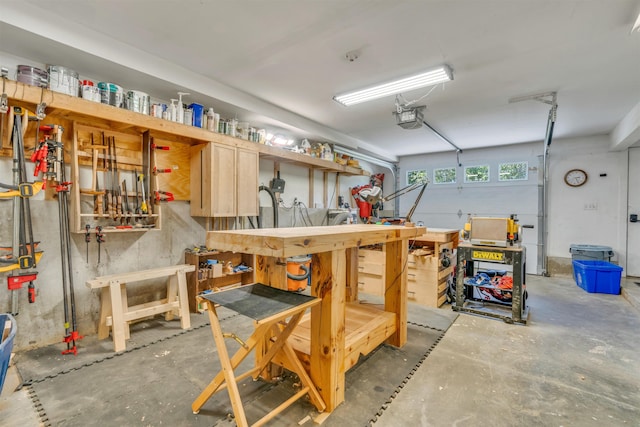 15 Winslow Dr, Somersworth, NH 03878 - garage featuring a workshop area and a garage door opener