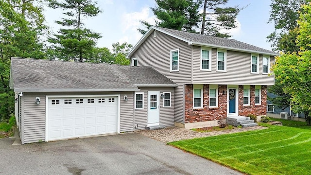 6 Lacy Ln, Nashua, NH 03062 - colonial home featuring a garage, driveway, brick siding, a front yard, and a shingled roof