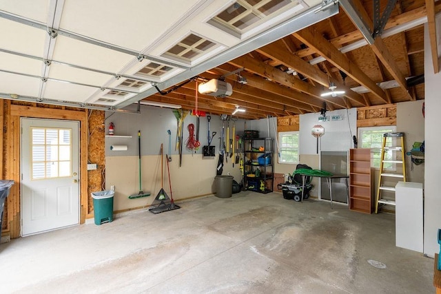 6 Lacy Ln, Nashua, NH 03062 - garage featuring a garage door opener