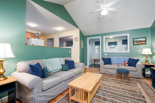 6 Lacy Ln, Nashua, NH 03062 - living room with a ceiling fan, light wood finished floors, and vaulted ceiling