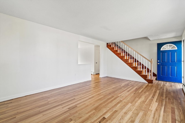9 Bryant Rd, Nashua, NH 03062 - entrance foyer with stairs and light wood-type flooring