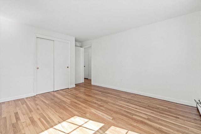 9 Bryant Rd, Nashua, NH 03062 - unfurnished bedroom with light wood finished floors and a closet